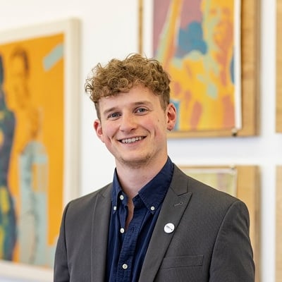 Man in suit with art background