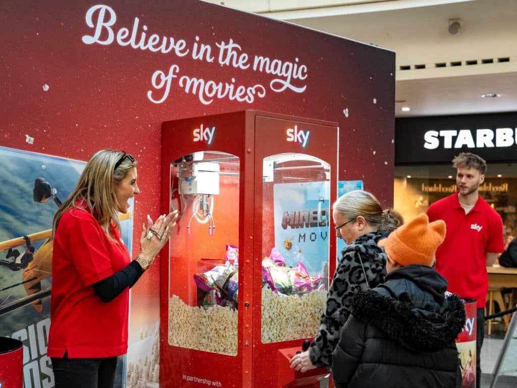 Children interacting with a movie-themed machine.