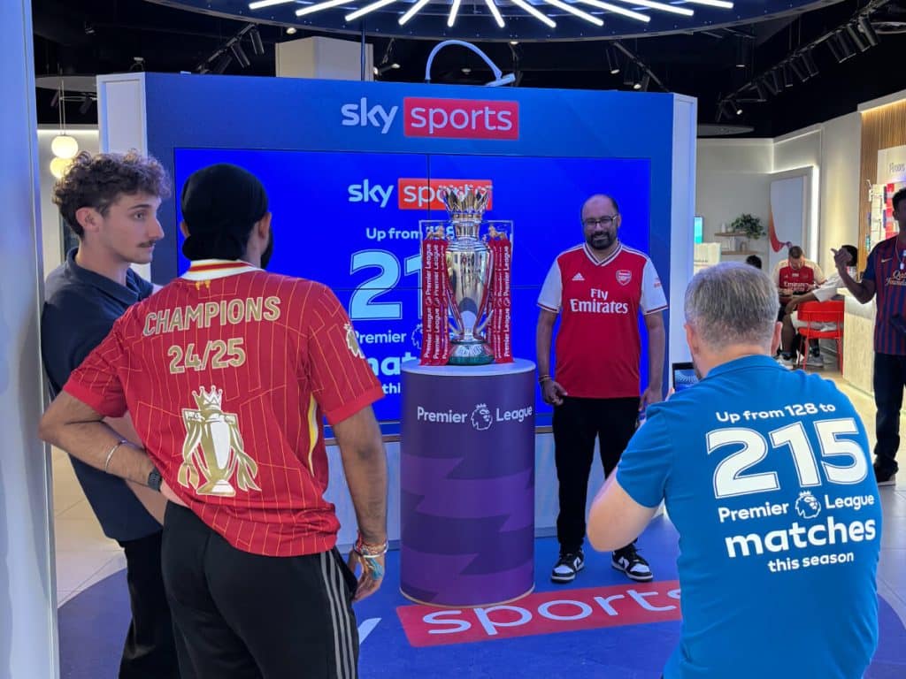 People admiring a trophy display.